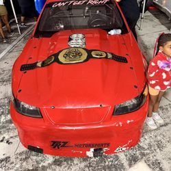 The Championship Belt and one of their Cars !
