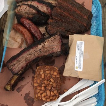 Franklin Barbecue - Brisket, pork ribs, beef rib, sausages, beans and banana bourbon pie (in the paper bag) - Barbeque Near Me - Austin, Texas