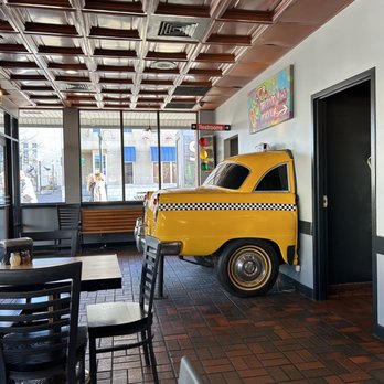 AJ's NY Pizzeria - a taxi cab in the dining room - Pizza Near Me - Manhattan, Kansas AJ's NY Pizzeria - a taxi cab in the dining room - Pizza Near Me - Manhattan, Kansas
