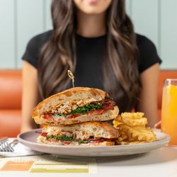 OEB Breakfast - Bridgeland - Smoked chicken, arugula, hardwood smoked bacon, tomatoes, chipotle aioli, artisan ciabatta