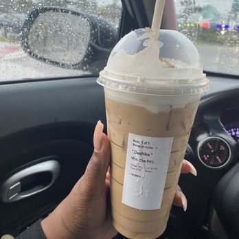 Starbucks - a hand holding a cup of iced coffee - Coffee & Tea Near Me - Winter Park, Florida Starbucks - a hand holding a cup of iced coffee - Coffee & Tea Near Me - Winter Park, Florida