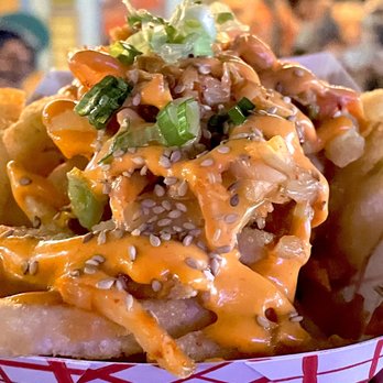 Ta-Da Chicken - Kimchi Fries. Fries topped with kimchi, scallions, hot sauce, and more $8 + tax + tip - Food Stands Near Me - New York, New York Ta-Da Chicken - Kimchi Fries. Fries topped with kimchi, scallions, hot sauce, and more $8 + tax + tip - Food Stands Near Me - New York, New York