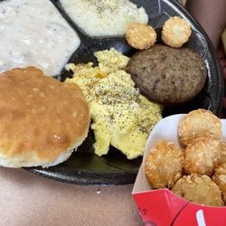Jack's Family Restaurant - Big breakfast with biscuit, gravy, grits, sausage, eggs and hash rounds.