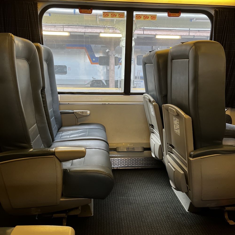 Business class seat.  Tons of leg room and the seats are wide and recline.  It's equivalent to first class seats on domestic US flights.