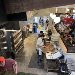 Pizza elves hard at work.