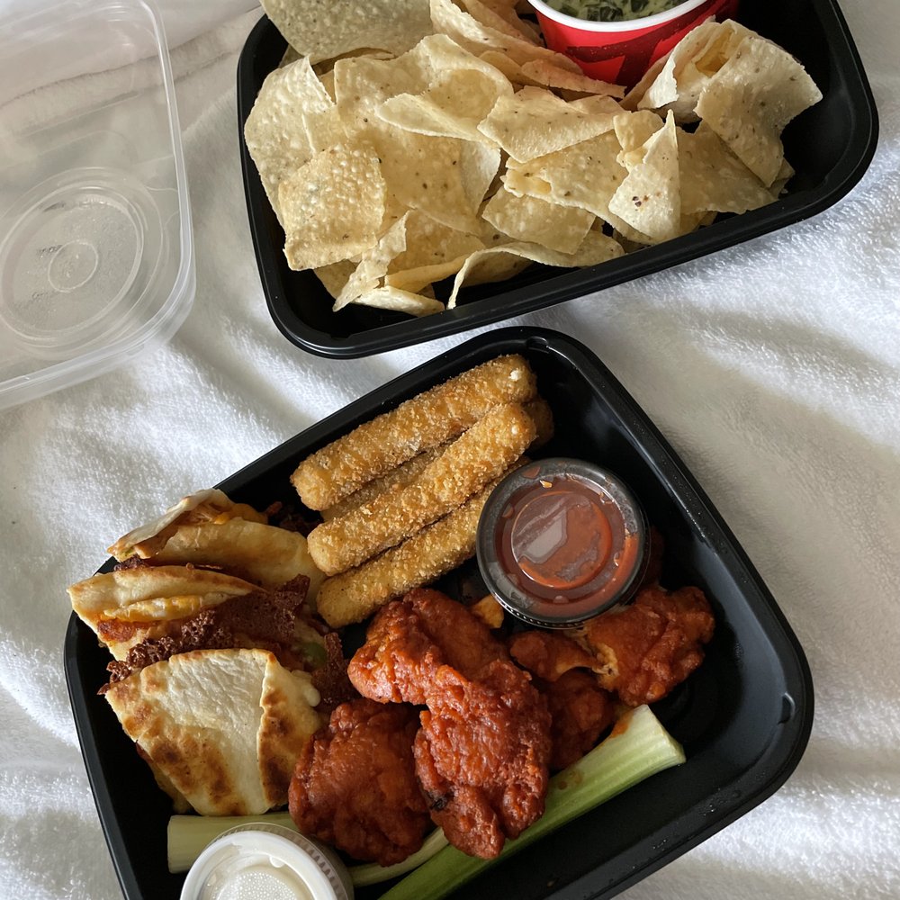 The Classic Combo: mozzarella sticks, chicken quesadillas, boneless buffalo wings, and spinach and artichoke dip with chips The Classic Combo: mozzarella sticks, chicken quesadillas, boneless buffalo wings, and spinach and artichoke dip with chips