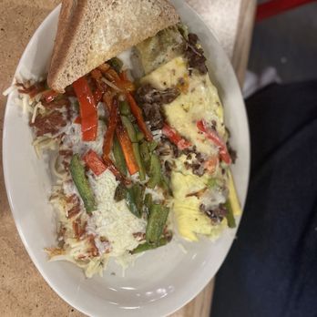Gingham's Homestyle Restaurant - Philly Steak Omelette and hashbrowns with peppers and pepper jack cheese and toast - American Near Me - Saint Charles, Missouri Gingham's Homestyle Restaurant - Philly Steak Omelette and hashbrowns with peppers and pepper jack cheese and toast - American Near Me - Saint Charles, Missouri