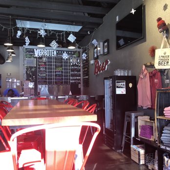 Verboten Brewing - Bar area and merch wall. - Breweries Near Me - Loveland, Colorado Verboten Brewing - Bar area and merch wall. - Breweries Near Me - Loveland, Colorado