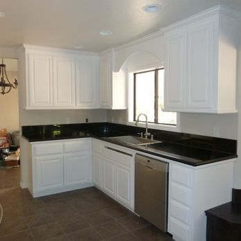 Triple E Construction - Practical yet stylish custom white cabinets, accented with decorative moldings and refined black granite countertops. - General Contractors Near Me - Chino Hills, California Triple E Construction - Practical yet stylish custom white cabinets, accented with decorative moldings and refined black granite countertops. - General Contractors Near Me - Chino Hills, California