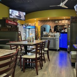 La Michoacana Taqueria And Mexican Snacks - Clean, neat interior. Serve your own salsa from the stainless cart.