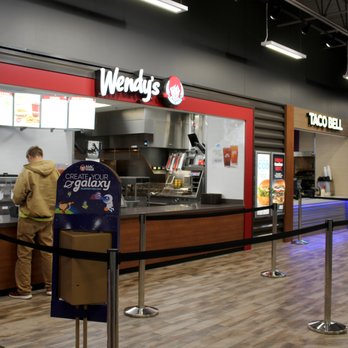 Wendy's - a man standing at the counter - Fast Food Near Me - Walcott, Iowa