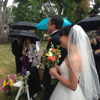 Admiral's Mansion - Father and bride in the rain - Venues & Event Spaces Near Me - Vallejo, California