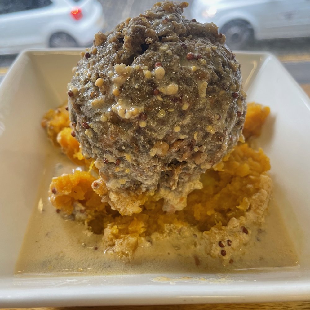 VEGAN HAGGIS - lentil "meat mixture" on top of mashed regular and sweet potatoes on a bed of whiskey and mustard gravy. VEGAN HAGGIS - lentil "meat mixture" on top of mashed regular and sweet potatoes on a bed of whiskey and mustard gravy.