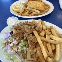 Captain Georges Fish and Chips - Chicken souvlaki with Greek salad and chips and Halibut dinner (chips and coleslaw).
