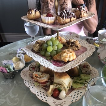 The Lizzie Rose - a woman sitting at a table with three tiered trays of food - Tea Rooms Near Me - Tuckerton, New Jersey The Lizzie Rose - a woman sitting at a table with three tiered trays of food - Tea Rooms Near Me - Tuckerton, New Jersey