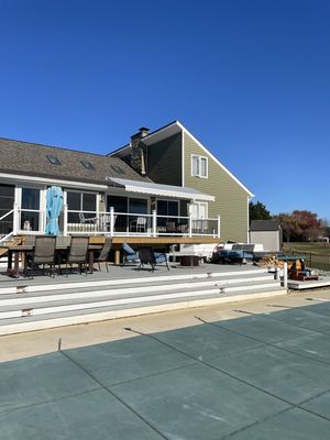 16 foot retractable awning - This awning was installed on a 24 foot deck, although we could have built a awning that would have covered the entire deck. The customer love this ideal of a 16 foot awning. This way the deck could be shared by everyone from the, sun worshippers to the shade seeker. This now the entire family’s gathering place together