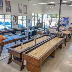 Universal Billiards - Shuffleboard, pool tables, and game room furniture for sale at our Frisco Showroom.