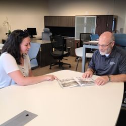 Office Furniture EZ - Founder Gary in a consultation with a customer at Office Furniture EZ's Denver Showroom at 3860 N Revere Street.