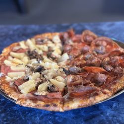 Half Hawaiian with mushrooms, half meat lovers. VERY generous with their toppings!