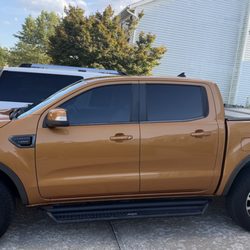 Auto Tint - 20% ceramic on front windows and 20% back and rear windshield over factory privacy glass