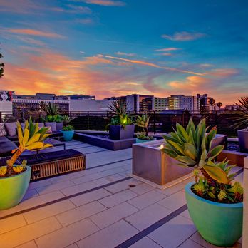Fiona - Twilight view of Fiona Apartments in West Hollywood, CA, highlighting the illuminated rooftop lounge with modern seating and ... - Apartments Near Me - West Hollywood, California Fiona - Twilight view of Fiona Apartments in West Hollywood, CA, highlighting the illuminated rooftop lounge with modern seating and ... - Apartments Near Me - West Hollywood, California