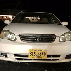 Sunset Hills Automotive - BEFORE: 2003 Toyota Corolla with dingy headlights and empty fog light socket.