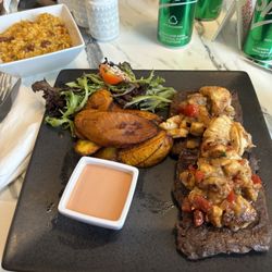 Moorings Beach Club - Churrasco topped with lobster, Puerto Rician rice (mamposteao) sweet plantain and salad.