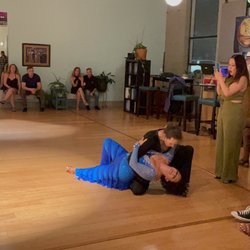 Arthur Murray Dance Studio Durham - Joel & Maria finishing a salsa show number at Latin Night at Arthur's