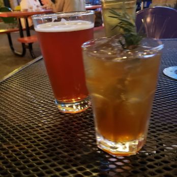 Doc's Backyard Grill - Johny Daly with the rosemary and a Cider Sangria in the pint glass. Both very very good. - American Near Me - Sunset Valley, Texas Doc's Backyard Grill - Johny Daly with the rosemary and a Cider Sangria in the pint glass. Both very very good. - American Near Me - Sunset Valley, Texas