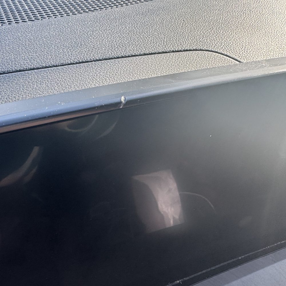 Damage to the trim around my nav system from the Safelite technician. Damage to the trim around my nav system from the Safelite technician.