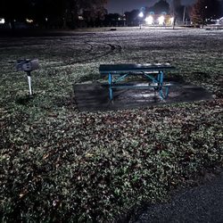 A view of one of the picnic table setups with charc grill. Facing east