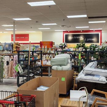 TJ Maxx - A retail store interior displaying shelves with storage containers, decorative items, and furniture, with overhead fluorescent lighting. - Department Stores Near Me - Tucson, Arizona