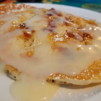 808 Grindz Cafe - Maple Bacon Pancakes covered in warm Mac Nilla sauce. This has no macadamia nuts BUT the batter had tree nuts in it, so be careful. - Cafes Near Me - Lahaina, Hawaii