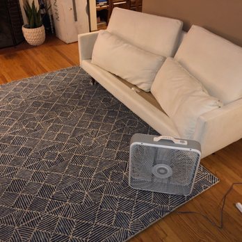 Midwest Carpet Care - Observe the immaculate area rug, freshly restored couch, and fan. - Carpet Cleaning Near Me Midwest Carpet Care - Observe the immaculate area rug, freshly restored couch, and fan. - Carpet Cleaning Near Me
