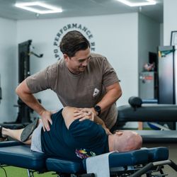 Capo Performance Rehab - Dr. Brandon Antonissen adjusting a patient.