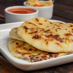 Pupuseria La Paz - Pupusas with salsa and curtido.