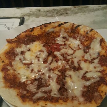 Basil's Restaurant & Tapas Bar - Complimentary table bread - pita topped with house tomato sauce (tastes like sun dried tomatoes were in it) and cheese - Mediterranean Near Me - Atlanta, Georgia