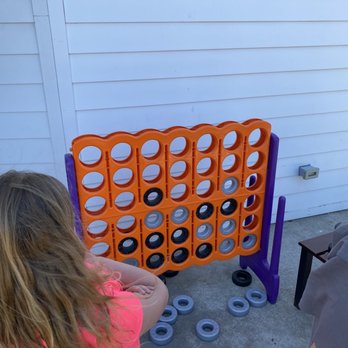 Donatos Pizza - a woman and a child playing a game - Pizza Near Me - Bowling Green, Kentucky