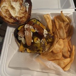 Miller - Doan Tavern - The Cowboy Burger served with onion petals, cheddar cheese and barbecue sauce.