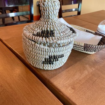 Koite Grill - a basket on a wooden table - Senegalese Near Me - Silver Spring, Maryland