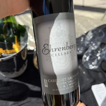 Ehrenberg Cellars - a hand holding a bottle of wine - Wineries Near Me - Livermore, California Ehrenberg Cellars - a hand holding a bottle of wine - Wineries Near Me - Livermore, California