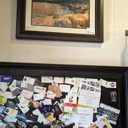 a picture of a fridge with a bunch of cards on it a picture of a fridge with a bunch of cards on it