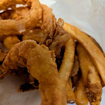 Phil's Icehouse - Close up of onion rings and fries - Burgers Near Me - Austin, Texas Phil's Icehouse - Close up of onion rings and fries - Burgers Near Me - Austin, Texas