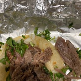 the meat and vegetables on the foil