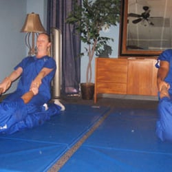 Huang's Health - Pain Treatment Clinic - Wilson, Owner and Manager of Huang's Health, In a Thai Massage Classroom