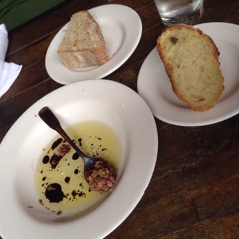 Fat Cats - They give you this when you first sit down. Good bread with olive oil, balsamic vinegar dip with chopped olives. Nice touch! - New American Near Me - Cleveland, Ohio