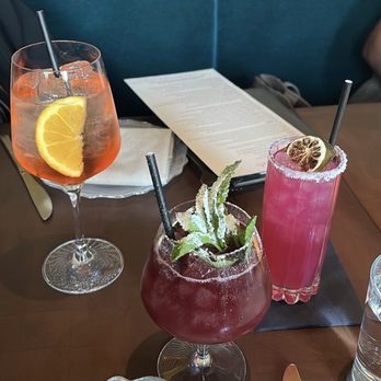 L'Ardente - From left to right: Aperol spritz, strawberry sbagliato, unknown purple/ pink drink to the right - Italian Near Me - Washington, DC, District of Columbia L'Ardente - From left to right: Aperol spritz, strawberry sbagliato, unknown purple/ pink drink to the right - Italian Near Me - Washington, DC, District of Columbia