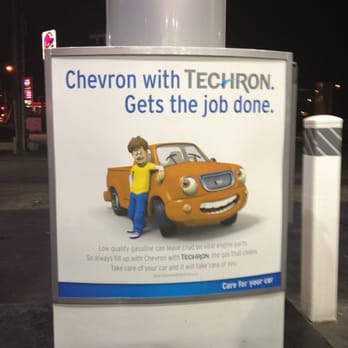 Chevron - a man standing next to a car - Gas Stations Near Me - Lynwood, California Chevron - a man standing next to a car - Gas Stations Near Me - Lynwood, California