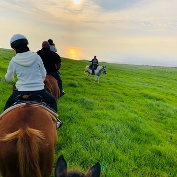 Paniolo Adventures - Sunset Ride with sun reflection on ocean - Horseback Riding Near Me Paniolo Adventures - Sunset Ride with sun reflection on ocean - Horseback Riding Near Me