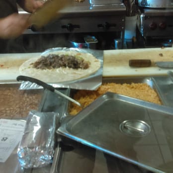Mexico Tipico - The man assembling the super burrito - Mexican Near Me - San Francisco, California Mexico Tipico - The man assembling the super burrito - Mexican Near Me - San Francisco, California